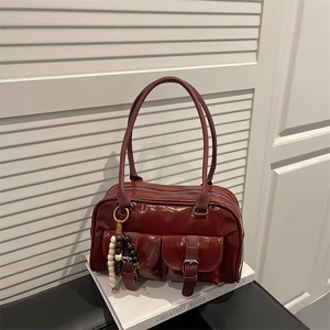 Retro burgundy faux leather shoulder bag with front buckle pockets and bead tassel