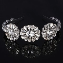 Detail view of the elegant rhinestone bridal headband with floral crystal clusters