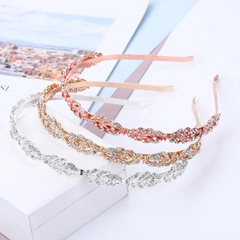 Detailed view of leaf-shaped bridal headbands in gold, silver, and rose gold with rhinestones