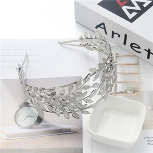 Detailed view of silver laurel leaf headband with metallic finish for bridal hair accessories