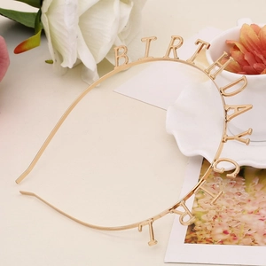Detailed view of the gold metal Birthday Girl headband for party accessories