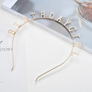 Golden Birthday Girl metal headband for parties on a stylish minimalist background