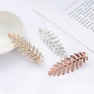 Three-piece leaf shape metal hair clips set with pearls in gold, silver and rose gold