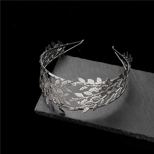 Greek style silver leaf bridal headband displayed on dark slate stone background