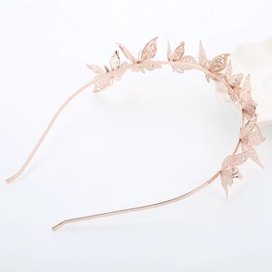 Elegante cerchietto per capelli in oro rosa con farfalle metalliche per donne