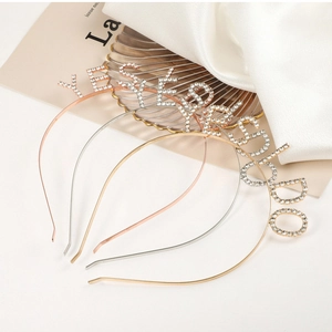 Detailed view of shimmering YES I DO rhinestone headband for bridal bachelorette parties