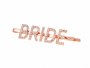 Macro view of rose gold BRIDE letter hair clip with sparkling crystal rhinestones