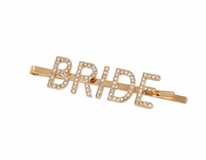 Detailed close-up of gold-plated alloy BRIDE hair clip with sparkling white rhinestones