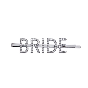 Detail of silver BRIDE hair clip with sparkling rhinestones for wedding styling