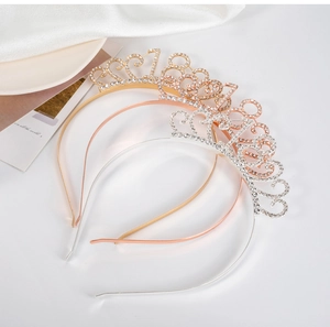 Detailed close-up of sparkling 18th birthday crown headbands in gold, rose gold and silver