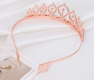 Detail of rose gold rhinestone crown showing crystal teardrop gems and side comb grips