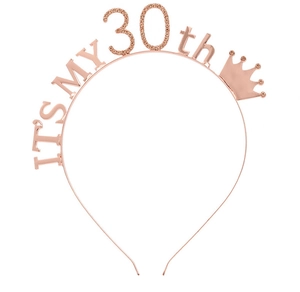 Detail of rose gold 30th birthday headband with glittering rhinestones and crown