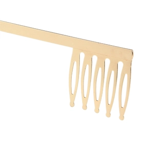 Close-up of golden alloy metal hair comb attachment for bridal crown and tiara