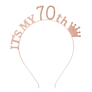 Detail of rose gold 70th birthday tiara with rhinestones and crown for party decor