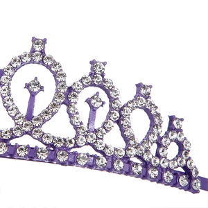 Close-up of intricate silver prongs and clear rhinestones on purple bridal crown