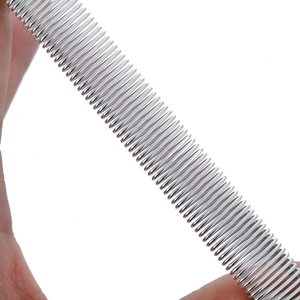 Detail of silver elastic metal armbands showing the spiral spring texture and flexibility