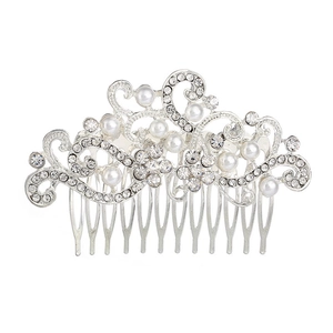 Detailed view of silver bridal hair comb with elegant pearls and crystal vine ornaments