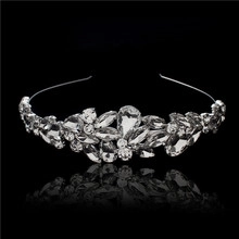Detail of silver bridal tiara featuring teardrop crystals and brilliant rhinestones