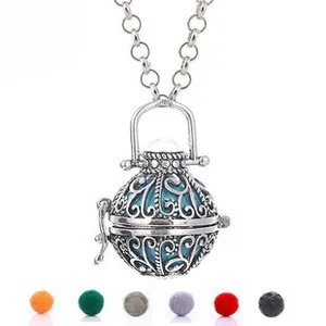 Hollow retro pendant with silver filigree and six colorful interchangeable inner beads