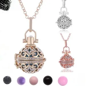 Detailed view of hollow rhinestone diffuser pendant with six colored aroma lava stones