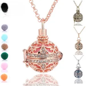 Detail of rose gold openwork aromatherapy necklace with crystal and colorful lava stones