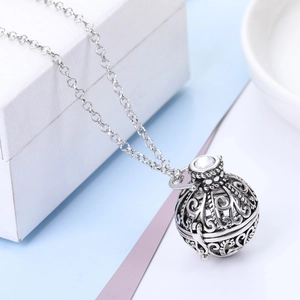 Vintage silver hollow flower aromatherapy diffuser necklace with white gemstone