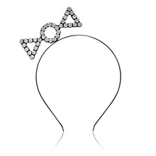 Close-up of minimalist black metal headband with rhinestone geometric icons