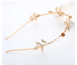 Detail of baroque gold leaf headband with miniature roses and white pearls