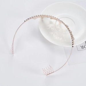 Elegant rose gold bridal tiara with sparkling rhinestones and securing hair combs