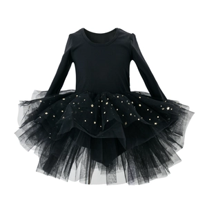 Close-up of black ballet tutu with gold star sequins and layered tulle ruffles