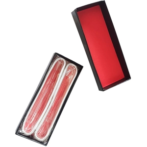 Silver chain accessories in a rectangular black gift box with vibrant red interior lining