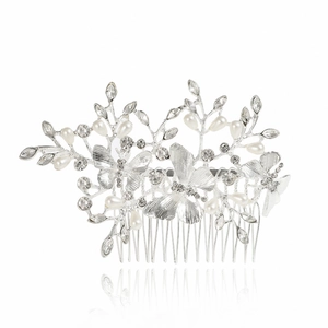 Elegant bridal hair comb with silver butterflies, pearls and crystals on white background