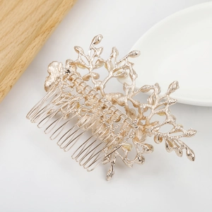 Elegant gold leaf and branch hair comb with a matte finish for bridal wedding styling
