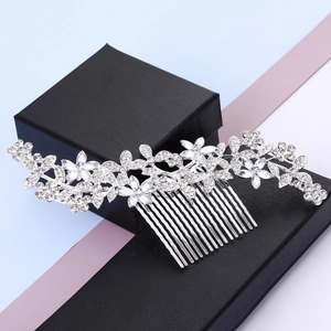 Elegant silver bridal hair comb with leaf patterns and sparkling crystal rhinestones
