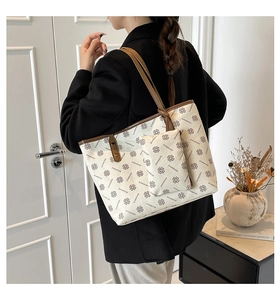 Detail of the diamond pattern tote bag with matching inner pouch and brown shoulder straps