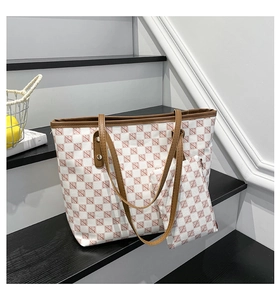 Detail view of the large capacity tote bag set with matching pouch in classic brown pattern