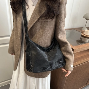 Retro black velvet hobo tote bag with spacious interior and sleek shoulder strap