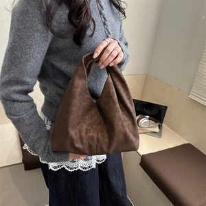 Brown leopard print suede hobo handbag with a minimalist aesthetic for daily use