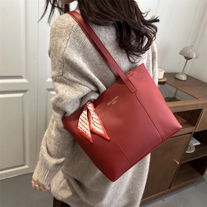Minimalist red faux leather tote bag with decorative scarf and large capacity for daily use