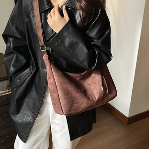 Brown vintage suede hobo bag with wide strap, oversized minimalist crossbody design