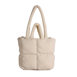 Minimalist off-white quilted puffer tote bag with dual straps and soft padded texture