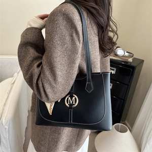 Large capacity black leather tote bag with white stitching and stylish silk scarf accessory