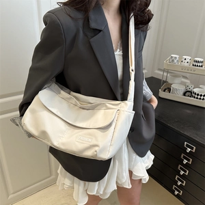 White large capacity crossbody tote bag with adjustable strap and fashion label detail