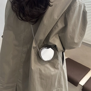 Minimalist silver apple-shaped metal mini crossbody bag with chain strap for women