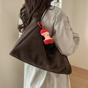Large capacity dark brown triangular tote bag with a unique plush apple core charm