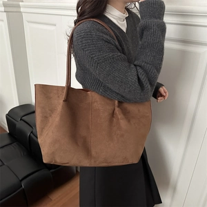 Minimalist brown suede tote bag for women showing spacious interior and sleek shoulder straps