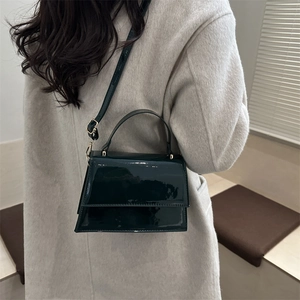 Minimalist deep green patent leather crossbody bag with top handle for women