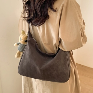 Brown retro hobo shoulder bag in faux suede with a cute plush bunny charm