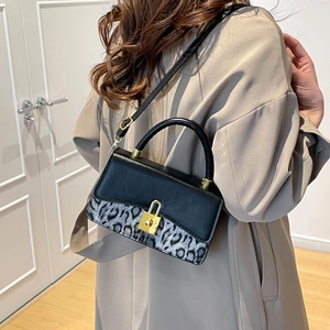 Chic black and leopard print crossbody bag with gold padlock for stylish women