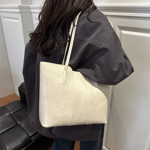 Retro large capacity cream PU leather tote bag with asymmetric design for daily commute